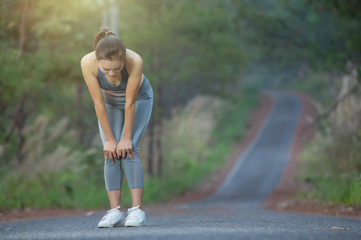 woman runner hold knee pain 1150 20538